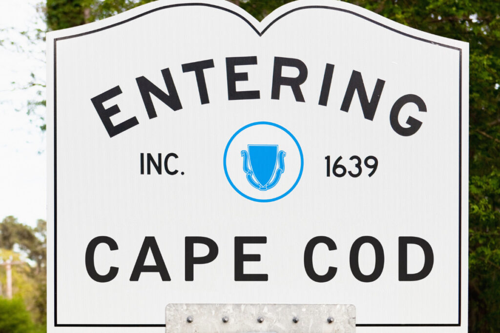 White sign welcoming visitors to Cape Cod